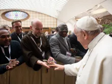 Pope Francis greets Father John Paul Mary Zeller during a meeting with Missionaries of Mercy at the Vatican on April 25, 2022.