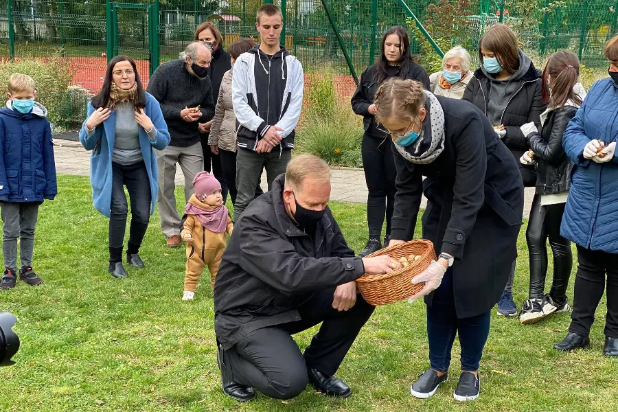 Archbishop Gintaras Grušas planting ‘fields of hope’ with supporters of Bl. Michael Sopocko Hospice near the house of St. Faustina Kowalska in Vilnius, Lithuania. / Archdiocese of Vilnius Facebook page.