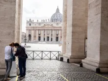 People use hand sanitizer before entering St. Peter's Basilica.