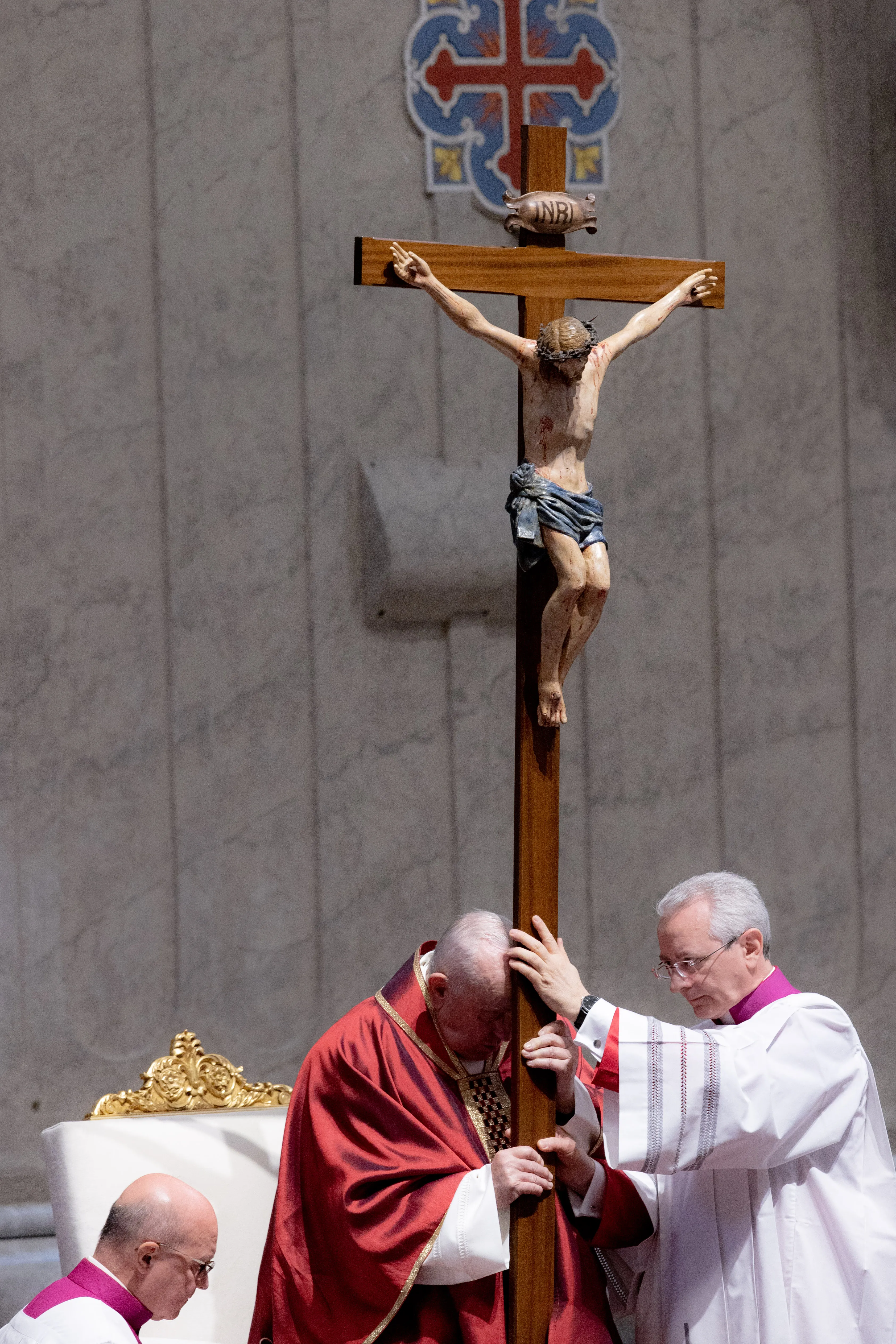Pope Francis adores the Holy Cross during the Liturgy of the Lord’s Passion on April 7, 2023. Daniel Ibanez/CNA