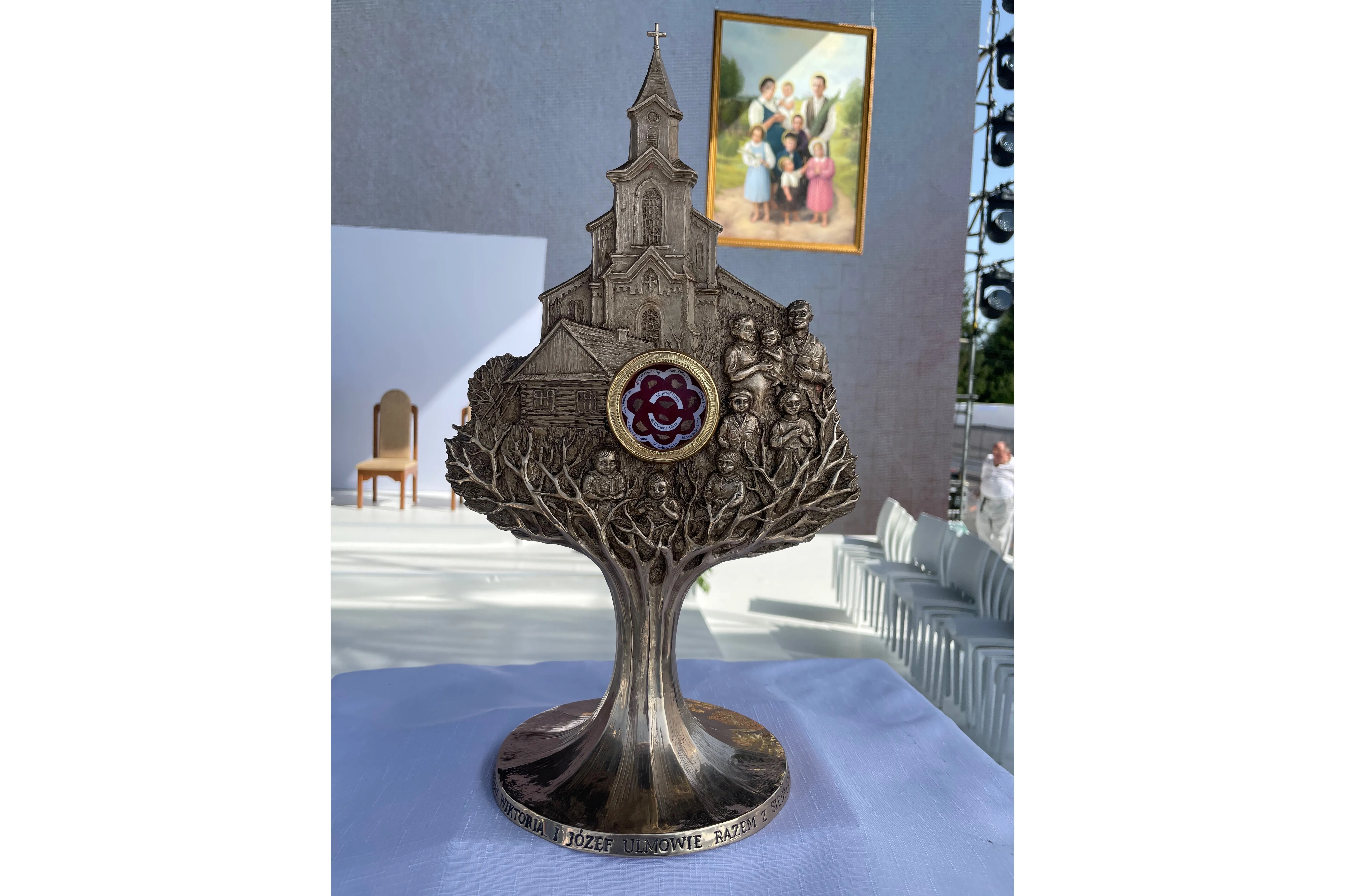 A reliquary of the Ulma family that was brought up as part of the beatification rite, with the family's official image in the background. Credit: Courtesy of Father Michael Niemczak