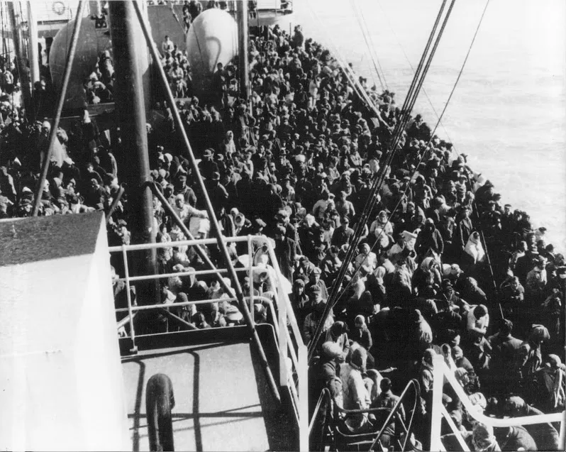 The USS Meredith piled with 14,005 refugees. / Public Domain.