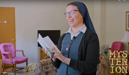 Sr. Danielle Victoria introduces a book she designed, called “Mysterion,” by Fr. Harrison Ayre. Screenshot from Daughters of St. Paul video