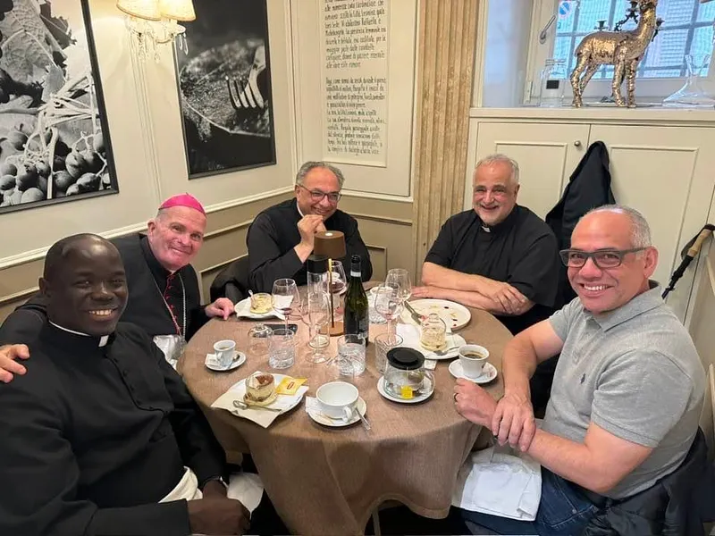 Bishop David O'Connell enjoys a meal in Rome on Jan. 3, 2024, with priests from the Diocese of Trenton, New Jersey: Monsignor Thomas N. Gervasio, Monsignor Sam Sirianni, Father Juan Daniel Peirano, and Father Jean Felicien. Credit: Courtesy of the Diocese of Trenton