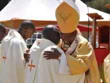 Father Michael Mithamo King’ori embraces Archbishop Anthony Muheria during his Jan. 14, 2023, ordination Mass.