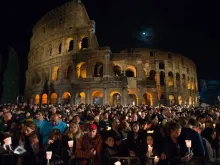 Pilgrims gather for the Stations of the Cross at the Colosseum in Rome on Good Friday, April 3, 2015.