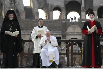 Pope Francis prays during an interreligious peace appeal at the Colosseum in Rome, Oct. 25, 2022.
