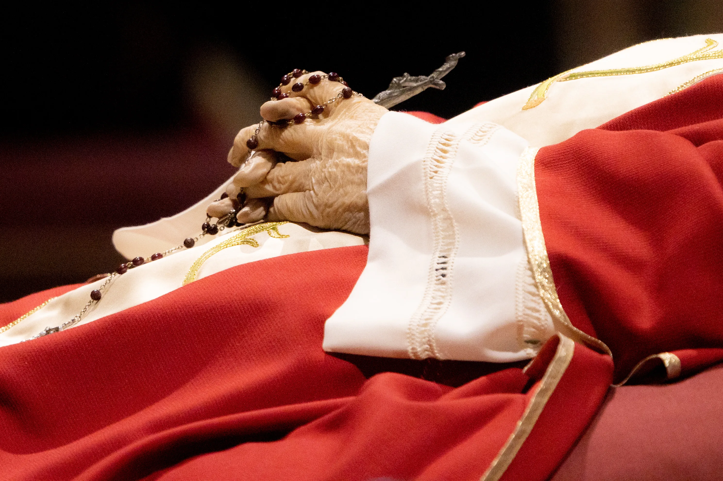 Rosary beads entwined in the hands of the late Pope Emeritus Benedict XVI as his body lies in state on Jan. 3, 2023, in St. Peter's Basilica.?w=200&h=150