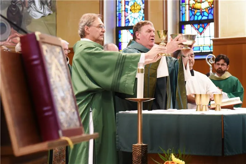 Deacon Paul Carris (left) serves at Mass next to Cardinal Joseph Tobin of the Archdiocese of Newark. Credit: Archdiocese of Newark