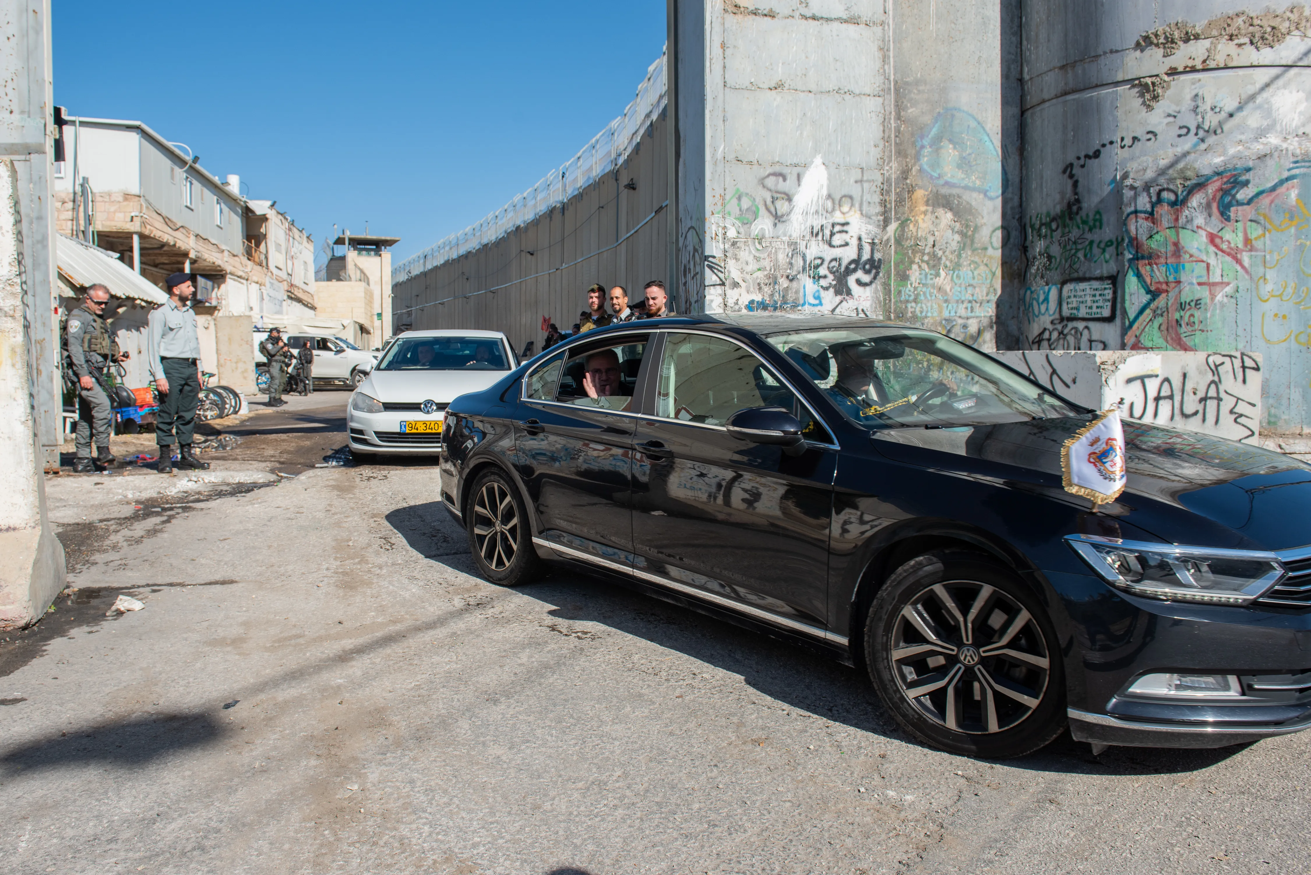 The car carrying the custos of the Holy Land, Father Francesco Patton, passes through the separation wall and enters Bethlehem on Saturday, Dec. 2, 2023. Credit: Marinella Bandini