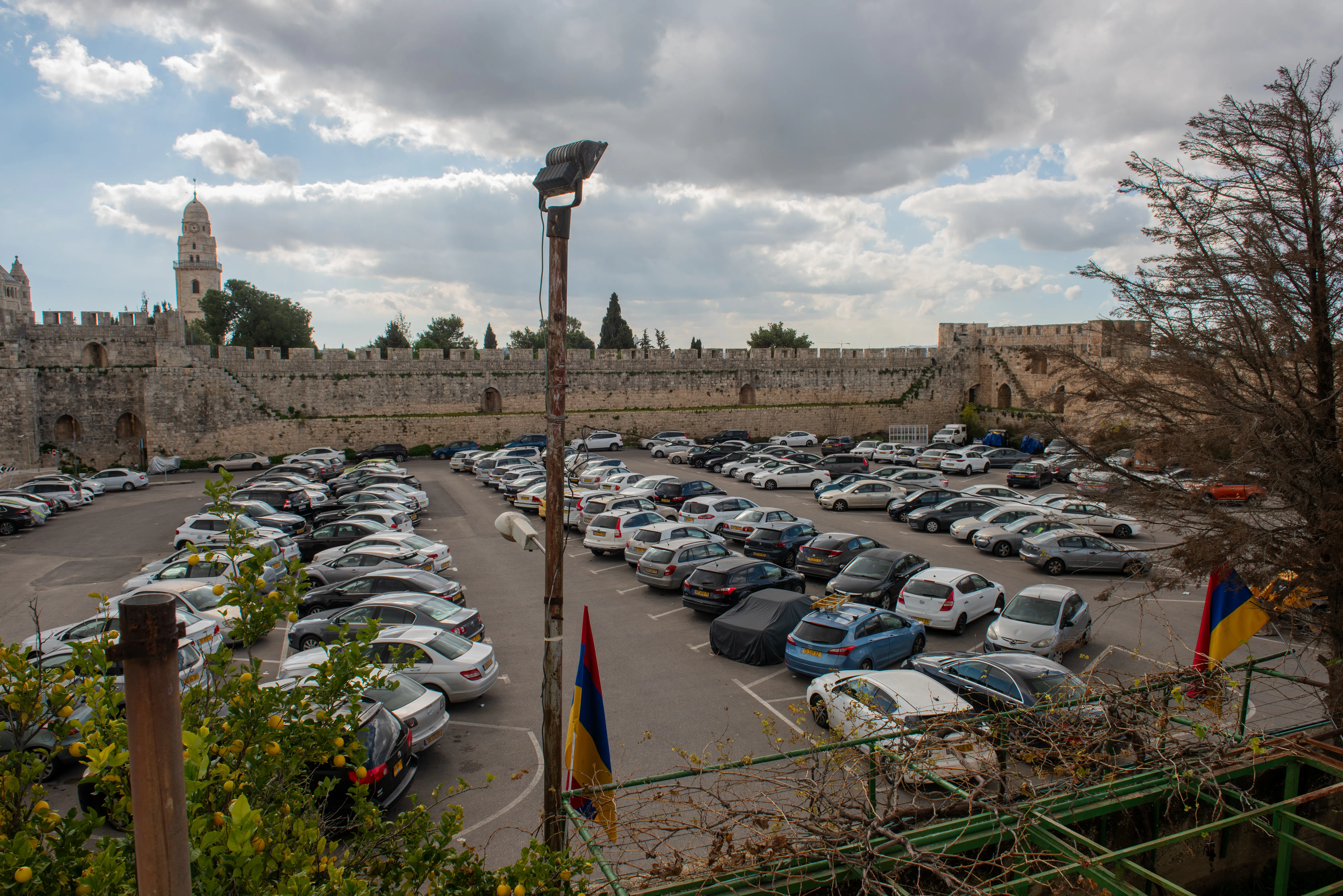The area known as Cows' Garden in the Armenian Quarter in the Old City of Jerusalem, seen from above. Currently, it serves as a parking lot. The area, together with some other Armenian properties, is at the center of an economic and judicial dispute after a lease deal was signed between the Armenian Patriarchate and the real estate company Xana Garden. Credit: Marinella Bandini