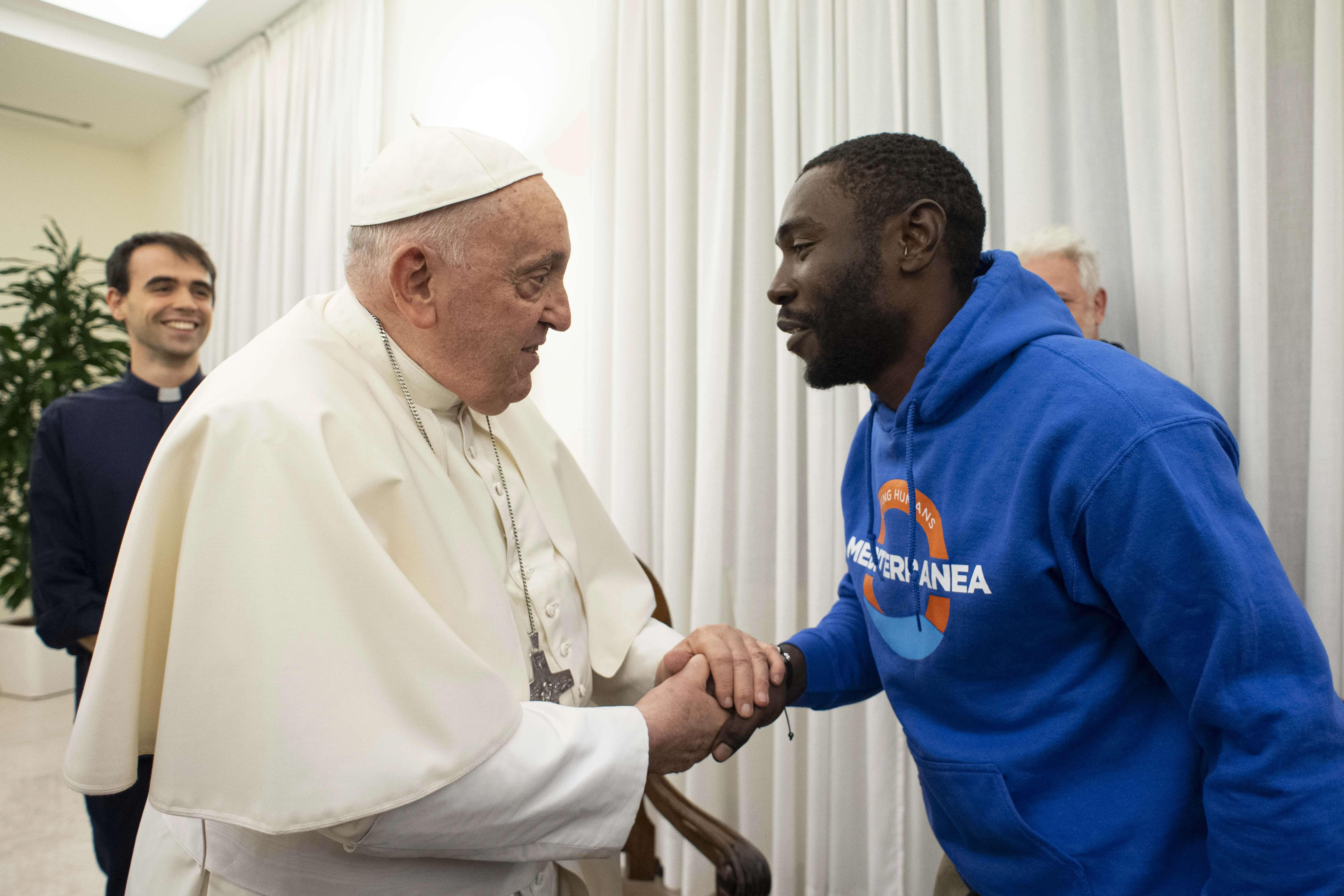 Pope Francis meets with Mbengue Nyimbilo Crepin, a 30-year-old man from Cameroon who shared his story during a meeting at the pope’s Vatican City residence Casa Santa Marta on Nov. 17, 2023. Credit: Vatican Media