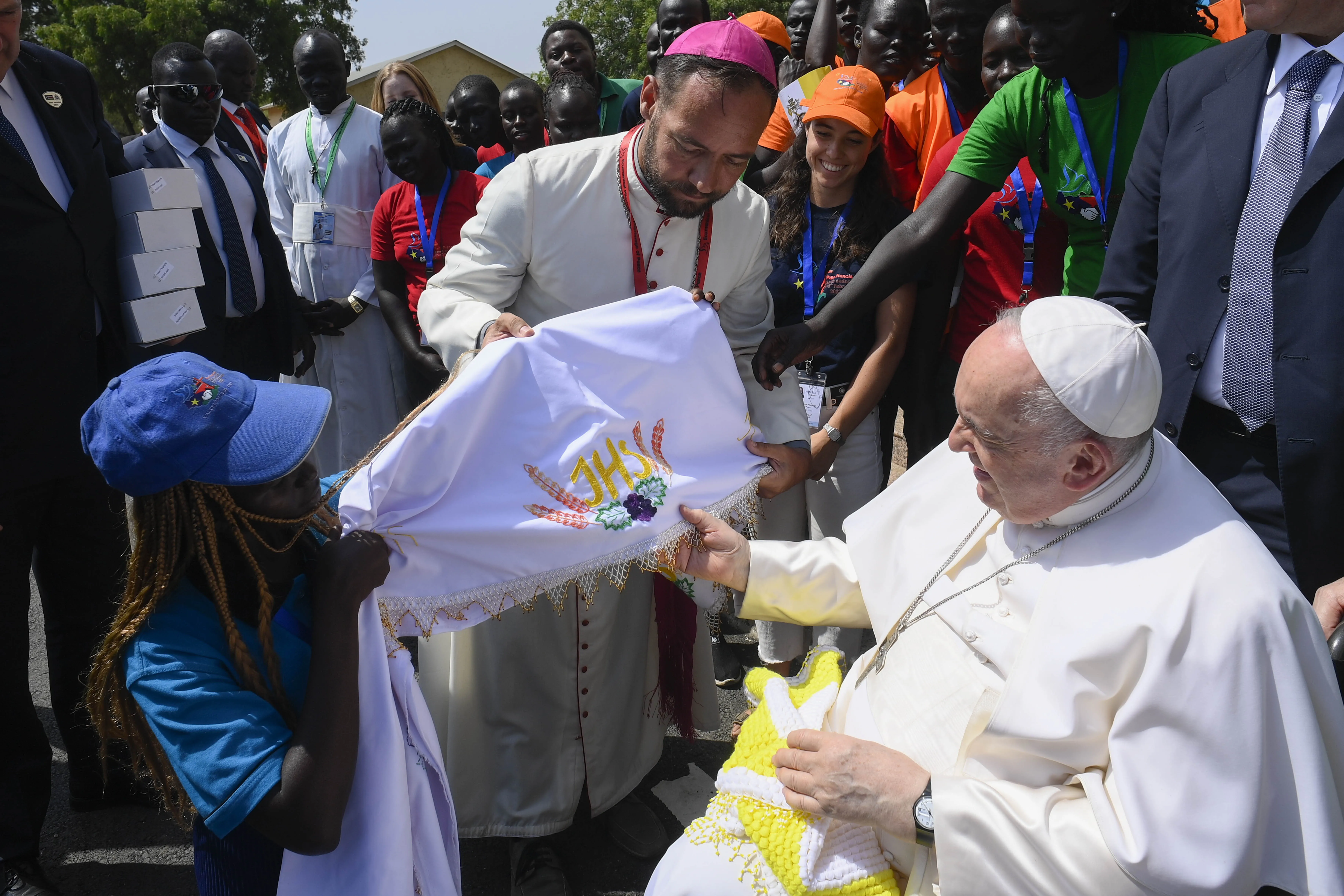 Pope Francis greets Bishop Christian Carlassare and youth of the Diocese of Rumbek outside St. Theresa Cathedral in Juba, South Sudan on Feb. 4, 2023. Vatican Media