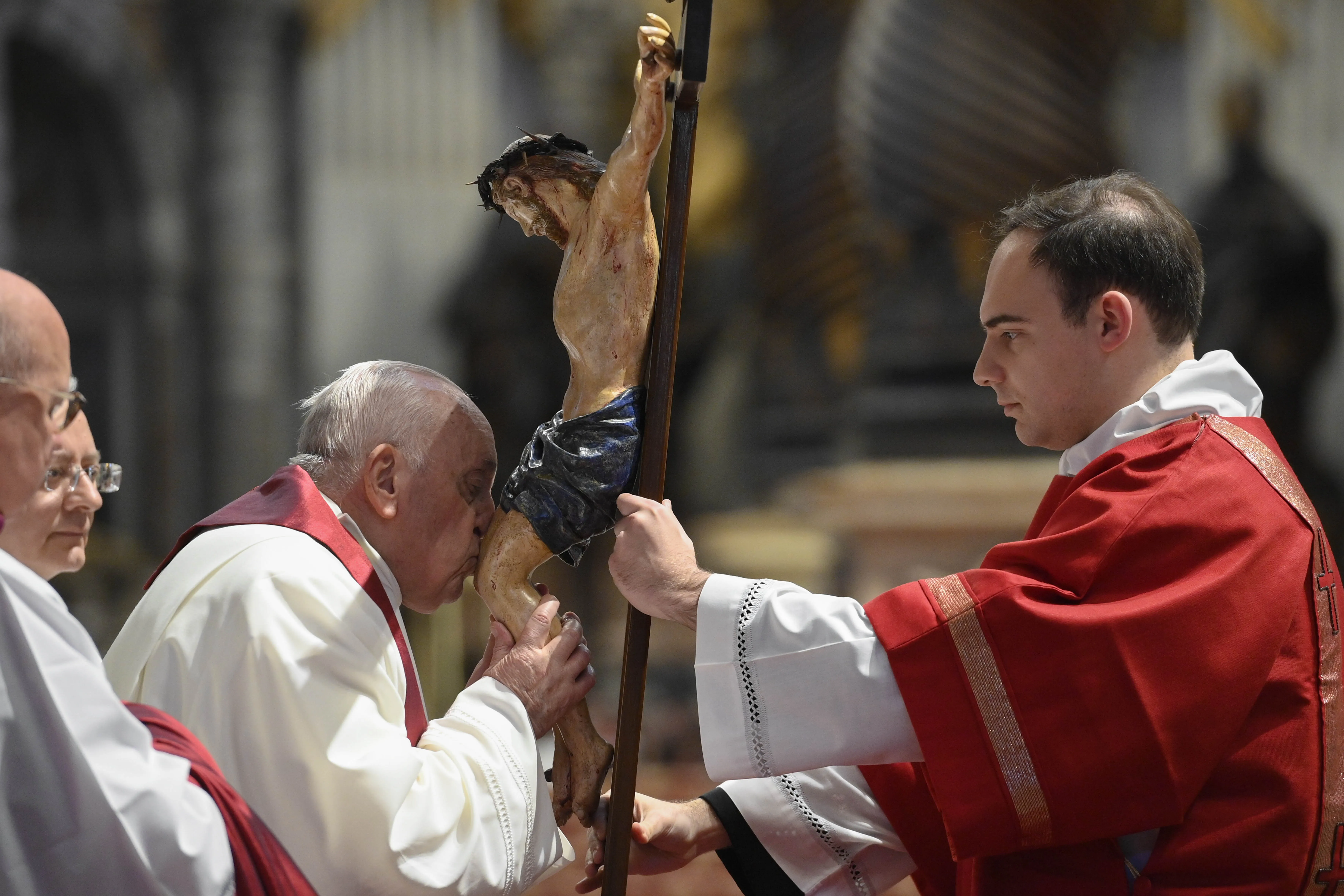 Pope Francis kisses the crucifix at the Liturgy of the Lord's Passion in St. Peter's Basilica on April 7, 2023.?w=200&h=150