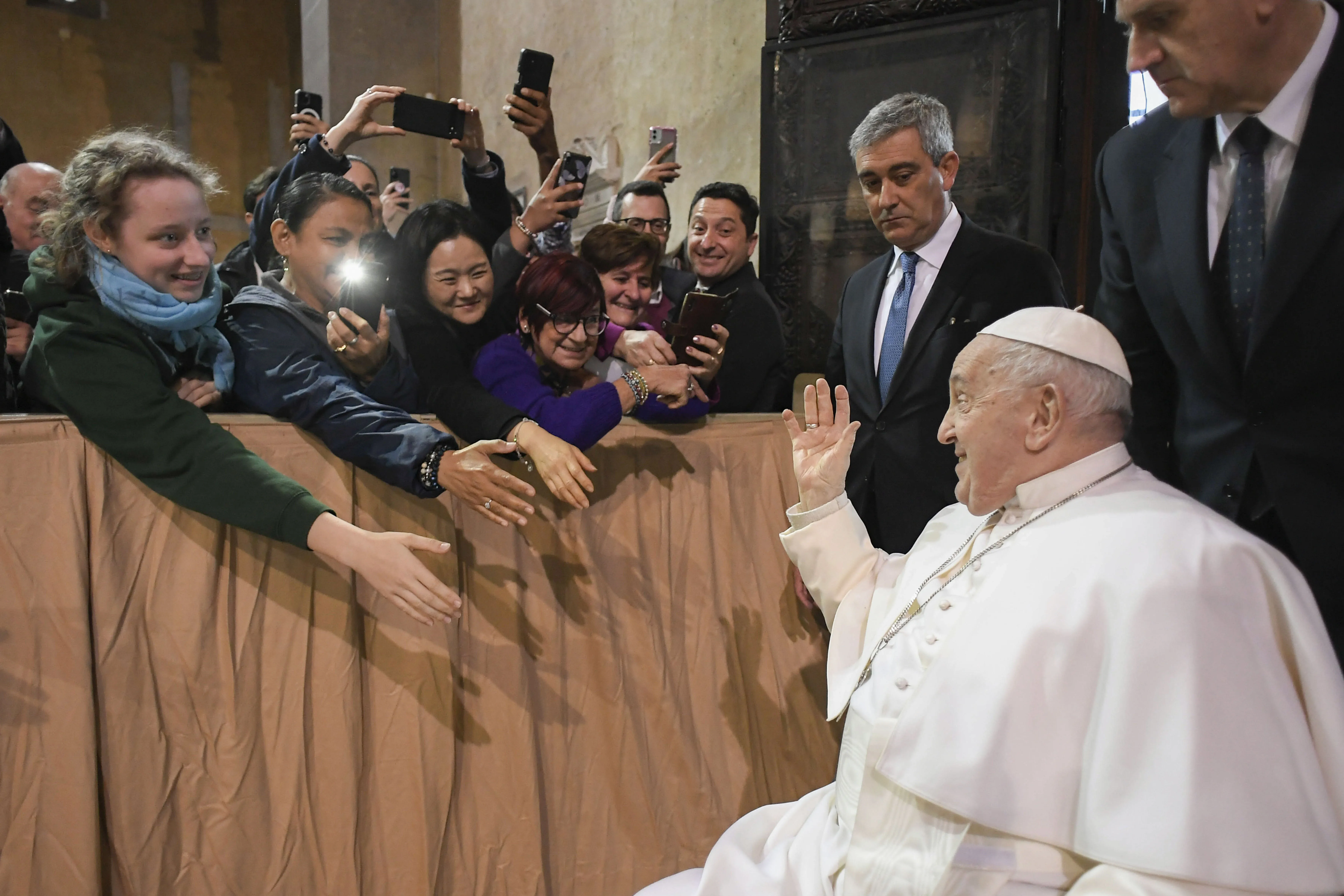 Pope Francis greets pilgrims ahead of Ash Wednesday Mass at the Basilica of Santa Sabina in Rome on Feb. 14, 2024. Credit: Vatican Media