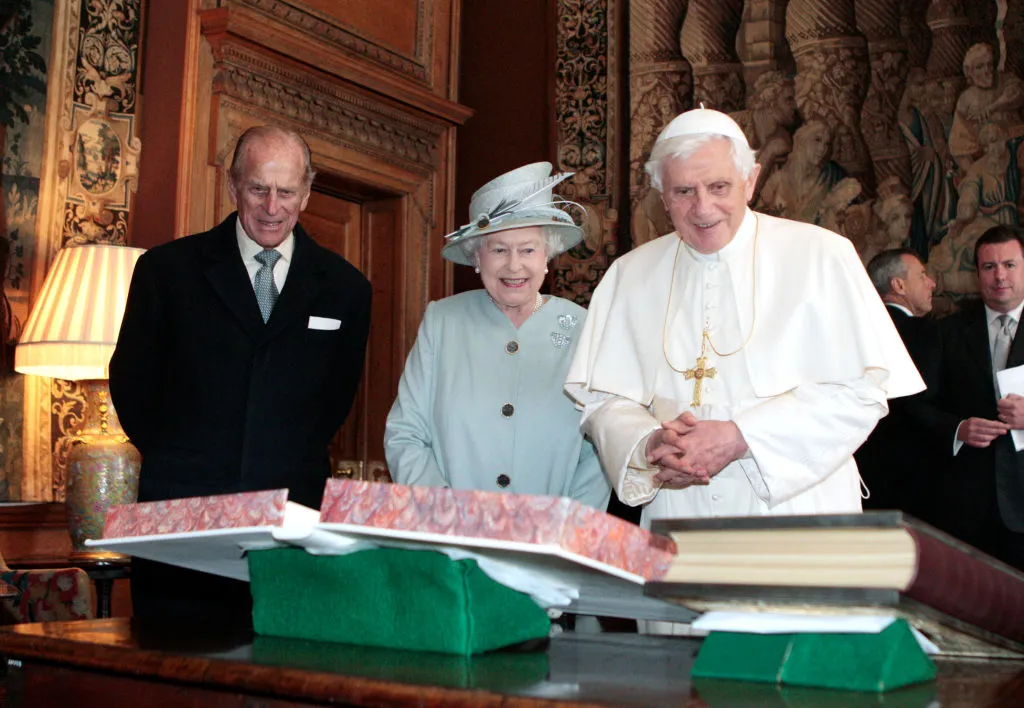 Prince Philip, Duke of Edinburgh (left) looks on as Queen Elizabeth II talks with Pope Benedict XVI and exchanges gifts during an audience in the Morning Drawing Room on day 1 of his four-day state visit to the United Kingdom at Holyrood House on Sept. 16, 2010 in Edinburgh, Scotland. Photo by David Cheskin / WPA Pool/Getty Images