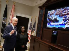 US President Joe Biden and Judge Ketanji Brown Jackson watch the US Senate vote on whether to approve Judge Brown's appointment to the US Supreme Court in the Roosevelt Room of the White House in Washington, DC, on April 7, 2022.