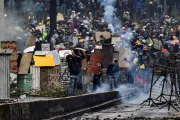 Demonstrators clash with riot police, nearby El Ejido park, in Quito, on June 24, 2022, in the framework of indigenous-led protests against the government.