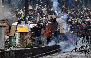 Demonstrators clash with riot police, nearby El Ejido park, in Quito, on June 24, 2022, in the framework of indigenous-led protests against the government. - Ecuador's government and Indigenous protesters accused each other of intransigence as thousands gathered for a 12th day of a fuel price revolt that has claimed six lives and injured dozens. After the most violent day of the campaign so far -- with police firing tear gas to disperse thousands storming Congress -- the government accused protesters of shunning a peaceful outcome. Martin Bernetti/AFP via Getty Images