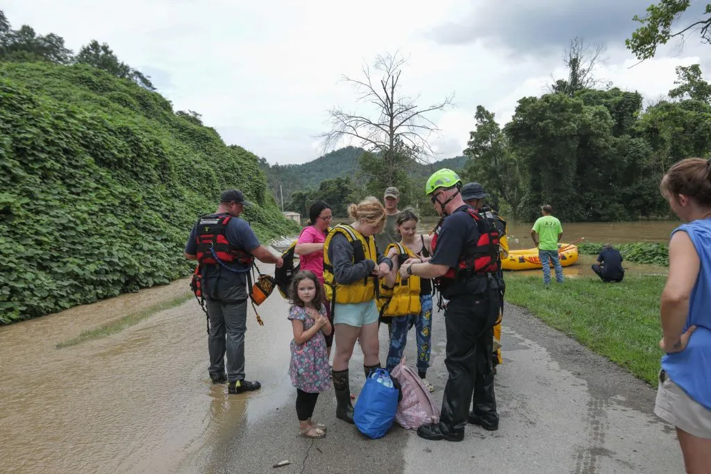 A stranded family is rescued from the flood waters of the north fork of the Kentucky River in Jackson, Ky., on July 28, 2022. Catholic Charities of Lexington is collaborating with other Christian churches as well as Catholic Charities USA to provide aid to those affected.?w=200&h=150