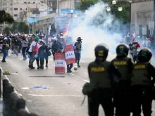 Riot policemen clash with demonstrators during a protest in Lima on Jan. 24, 2023.