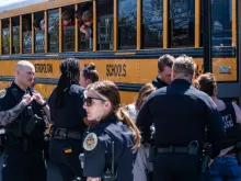 School buses with children arrive at Woodmont Baptist Church to be reunited with their families after a mass shooting at The Covenant School on March 27, 2023, in Nashville, Tennessee. According to initial reports, three students and three adults were killed by the shooter, a 28-year-old woman. The shooter was killed by police responding to the scene.