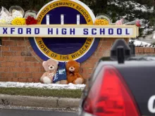 Stuffed bears sit at a makeshift memorial outside of Oxford High School on December 01, 2021 in Oxford, Michigan. Yesterday, four students were killed and seven injured when a gunman opened fire on students at the school. A 15-year-old sophomore, believed to be the only gunman, is in custody,
