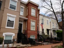 A red-brick row house (C) is seen where DC Metro Police said they found five fetuses inside where anti-abortion activists were living earlier this week in the Capitol Hill neighborhood on April 01, 2022 in Washington, DC. Nine people, some of whom lived or stayed in the house, were indicted Wednesday on federal civil rights counts, with prosecutors alleging that they violated the Freedom of Access to Clinic Entrances Act when they blockaded an abortion clinic with chain and rope in 2020. Authorities do not know how the fetuses were obtained or how they got into the home where anti-abortion activist Lauren Handy was staying before she was arrested.