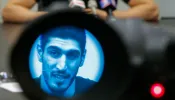 Turkish NBA Player Enes Kanter Freedom, seen through a video camera, speaks to the media during a news conference on May 22, 2017, in New York City.