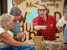 Approximately 1,400 members of St. Matthew Catholic Church in Charlotte, North Carolina, put together eight large shipping containers with more than 300,000 meals for Haitians as part of its Monsignor McSweeney World Hunger Drive on Aug. 12, 2023.