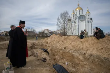 Major Archbishop Sviatoslav Shevchuk prays on April 7, 2022, for Ukrainians killed by Russian forces in Bucha.