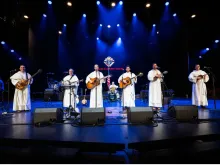 The Hillbilly Thomists perform on Aug. 1, 2022, at the Grand Ole Opry in Nashville, Tennessee. The bluegrass band, made up of Dominican friars, was the opening act of a concert hosted by the Knights of Columbus in conjunction with the fraternal order's annual convention.