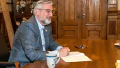 Indiana Governor Eric Holcomb signs bills in Indianapolis, March 10, 2022.