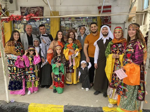 A Christian family in Qaraqosh sporting their traditional dressing for Holy Week in April 2022.?w=200&h=150