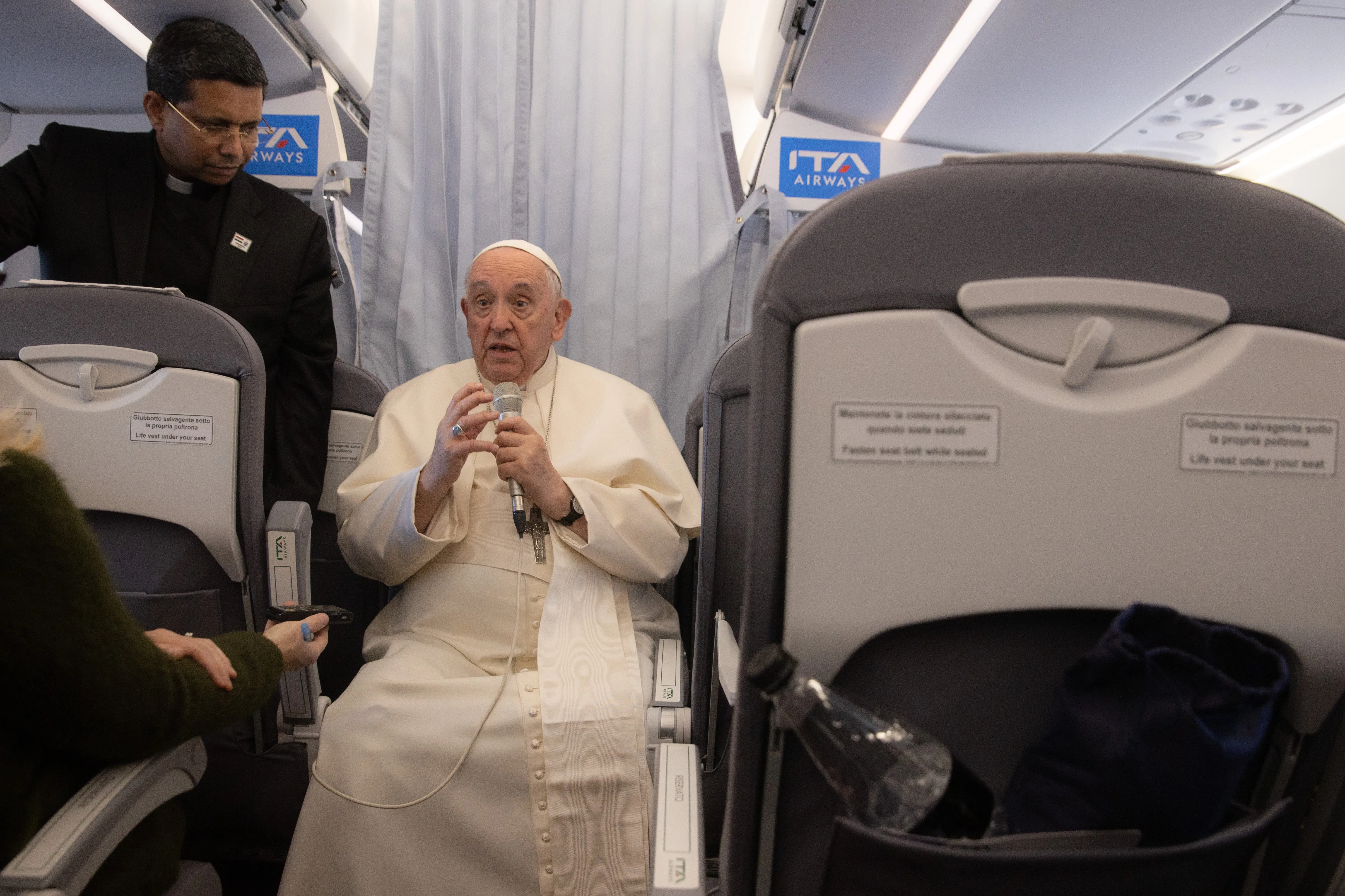 Pope Francis takes questions from the media aboard the papal flight from Hungary to Rome April 30, 2023.?w=200&h=150