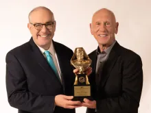 EWTN Chairman and Chief Executive Officer Michael P. Warsaw presents the 2022 Mother Angelica Award to former NFL star and coach Danny Abramowicz in honor of his lifetime of service to the new evangelization.