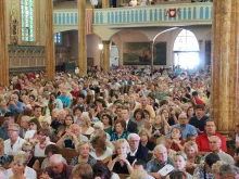 Massgoers fill St. Albertus Church in Detroit, Michigan, for Mass Mob V Aug. 10, 2014. The movement, which started in Buffalo in 2013 and quickly spread to other cities, found a lasting home in Detroit, which celebrated 51 events at historic city churches from 2014-19.