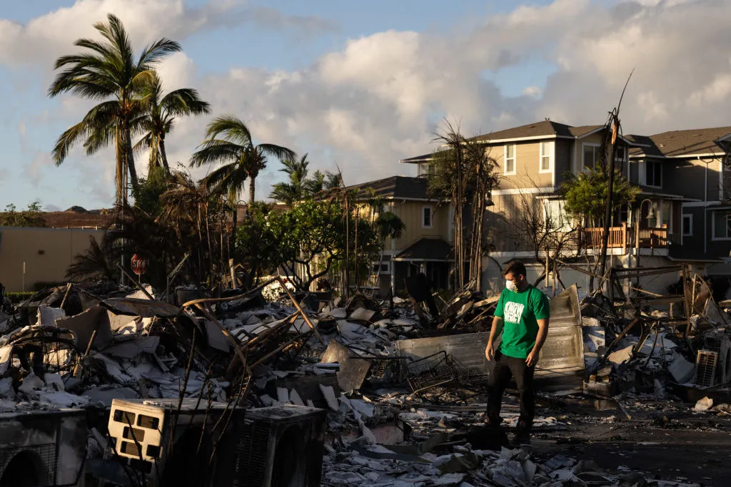A Mercy Worldwide volunteer makes damage assessment of charred apartment complex in the aftermath of a wildfire in Lahaina, western Maui, Hawaii on Aug. 12, 2023. Yuki Iwamura/AFP via Getty Images)