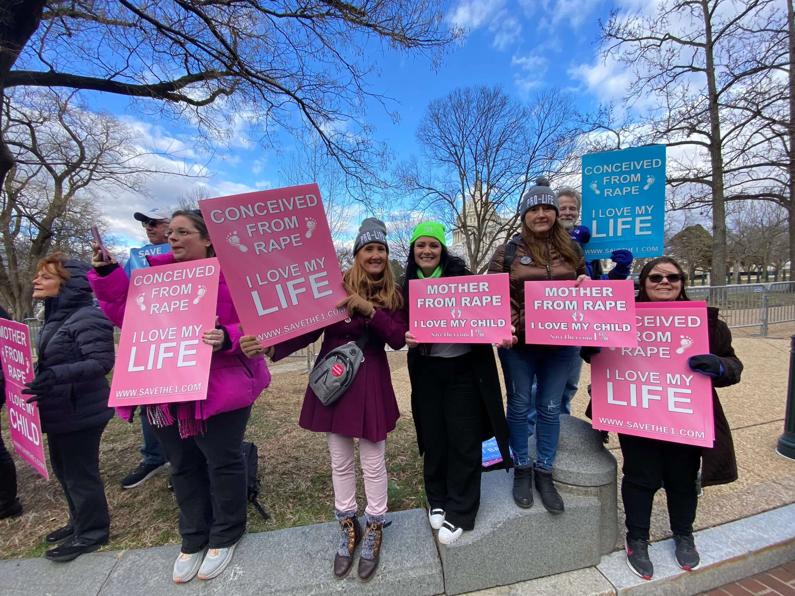 Rebecca Kiessling and her group, Save the 1, hold pro-life signs at the March for Life. Katie Yoder