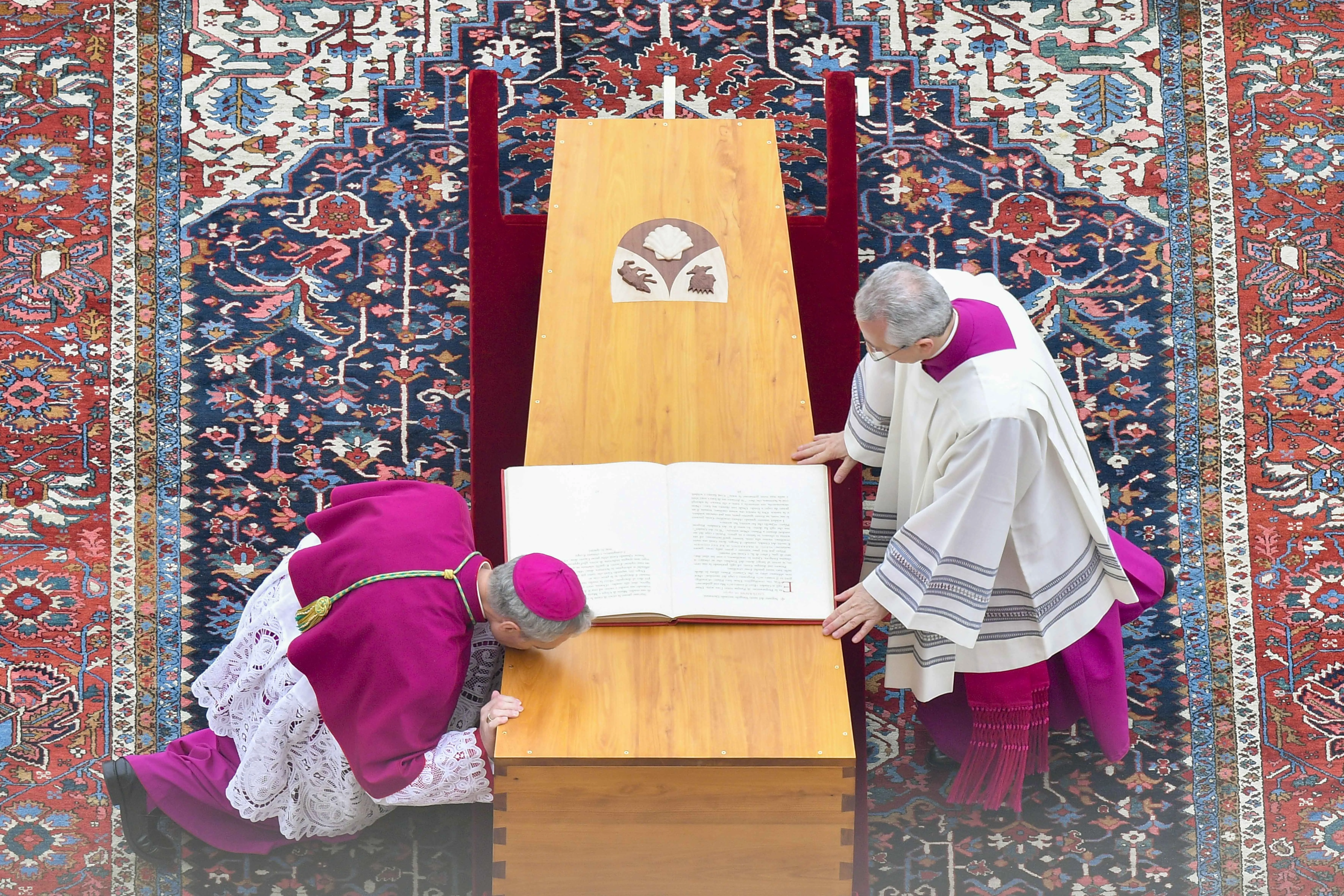 Archbishop Georg Ganswein (left), longtime personal secretary of Pope Benedict XVI, kisses the coffin of friend and mentor at his funeral on Jan. 5, 2023, at the Vatican.?w=200&h=150
