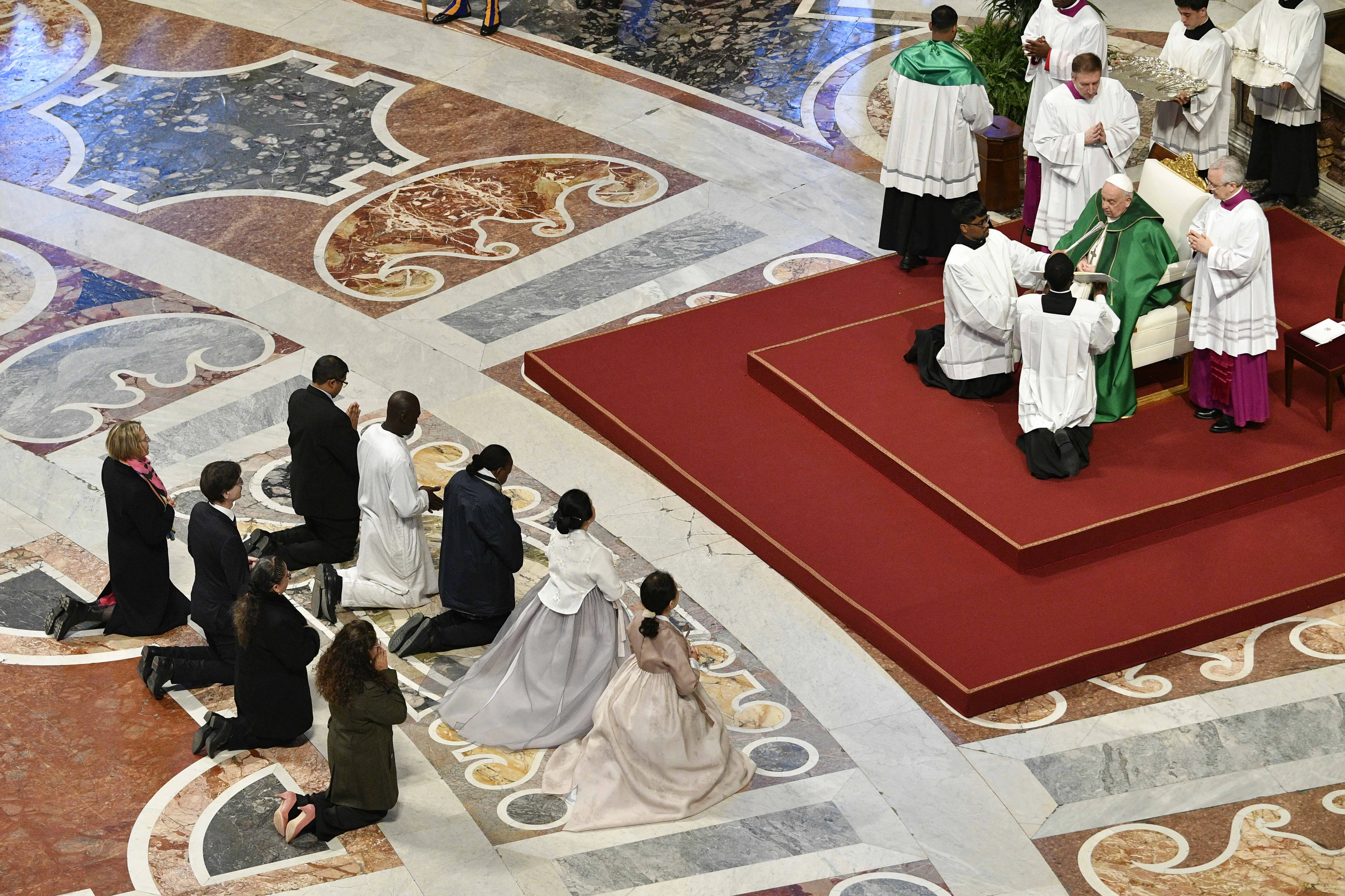 Pope Francis confers the lay ministry of catechist upon nine people during Mass for the Sunday of the Word of God on Jan. 21, 2024. Vatican Media