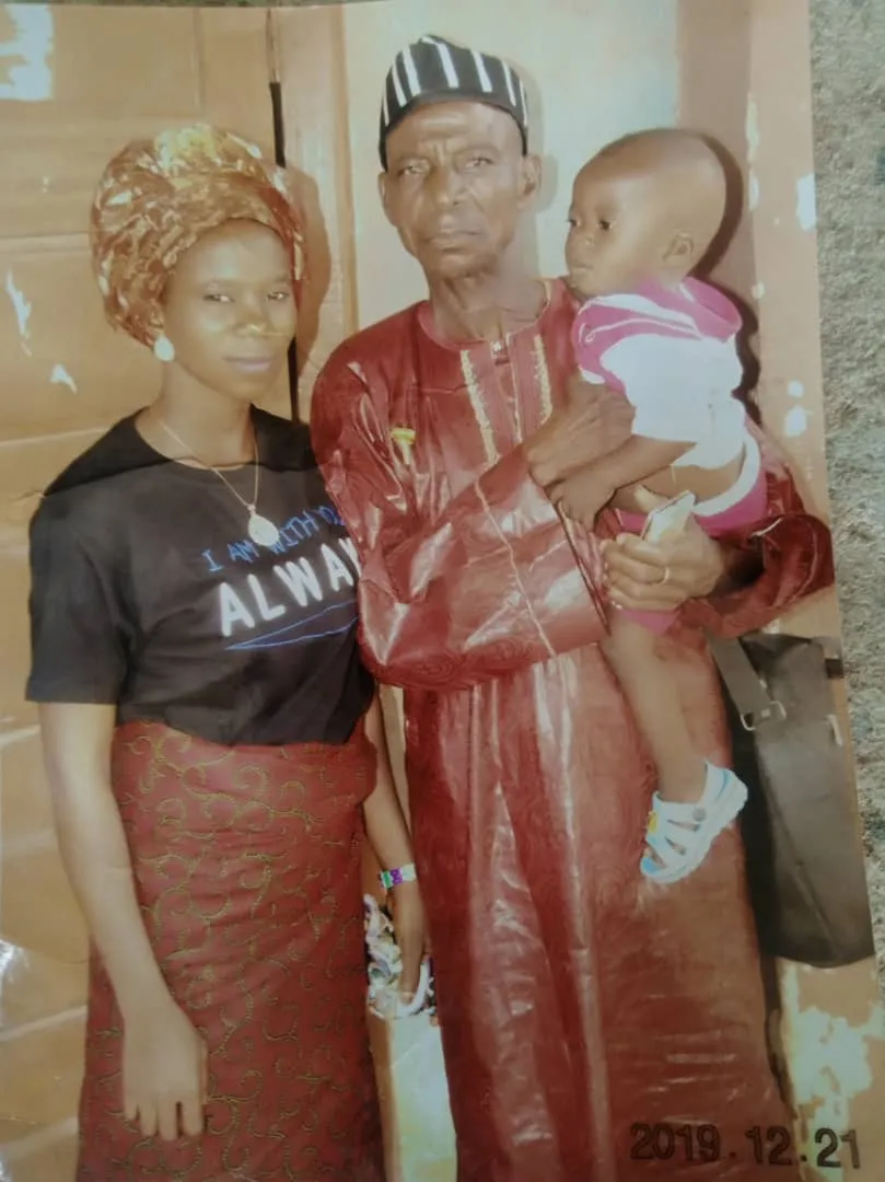 Joy Akaa and her late husband, Orguze (center), with one of the couple's three children. Orguze Akaa, 50, a farmer from Benue State, Nigeria, whose family was uprooted by terror attacks in the region, was ambushed and killed on June 30, 2022, while seeking food for his family. Courtesy of Adakole Daniel