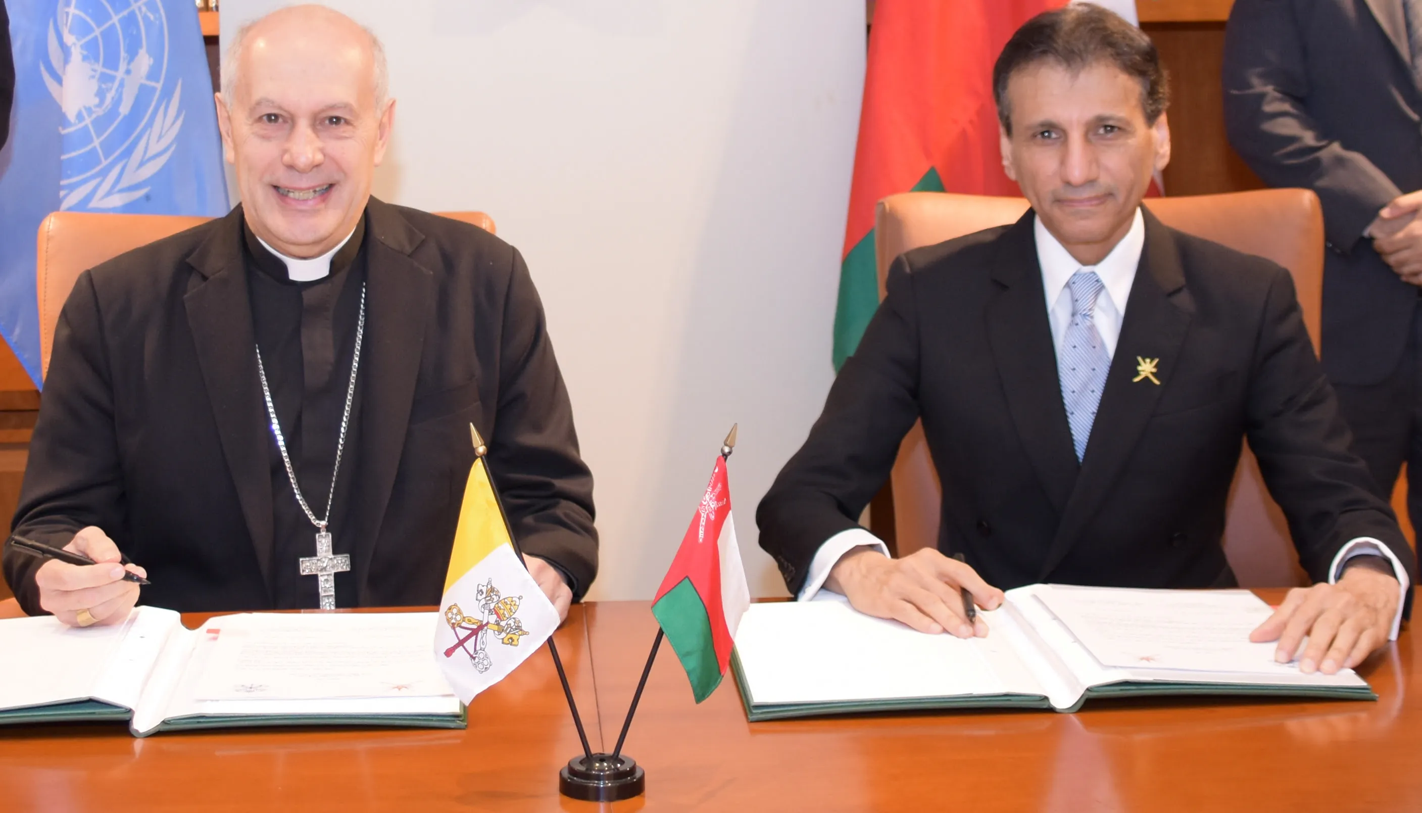 Archbishop Gabriele Caccia, Holy See Permanent Observer to the United Nations (left), and Mohammed Al-Hassan, Ambassador Extraordinary and Plenipotentiary of the Sultanate of Oman to the United Nations, at a signing ceremony establishing diplomatic relations between Oman and the Holy See. The ceremony took place  at the Permanent Mission of the Sultanate of Oman to the United Nations in New York City.?w=200&h=150