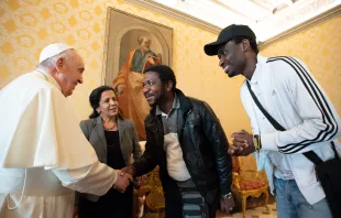 Pope Francis meets with refugees whom he helped to bring to Italy on his 85th birthday, Dec. 17, 2021. Vatican Media