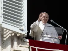 Pope Francis waves to the crowd during the Sunday Angelus.
