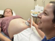 A patient sees her growing baby during an ultrasound conducted at a check-up.