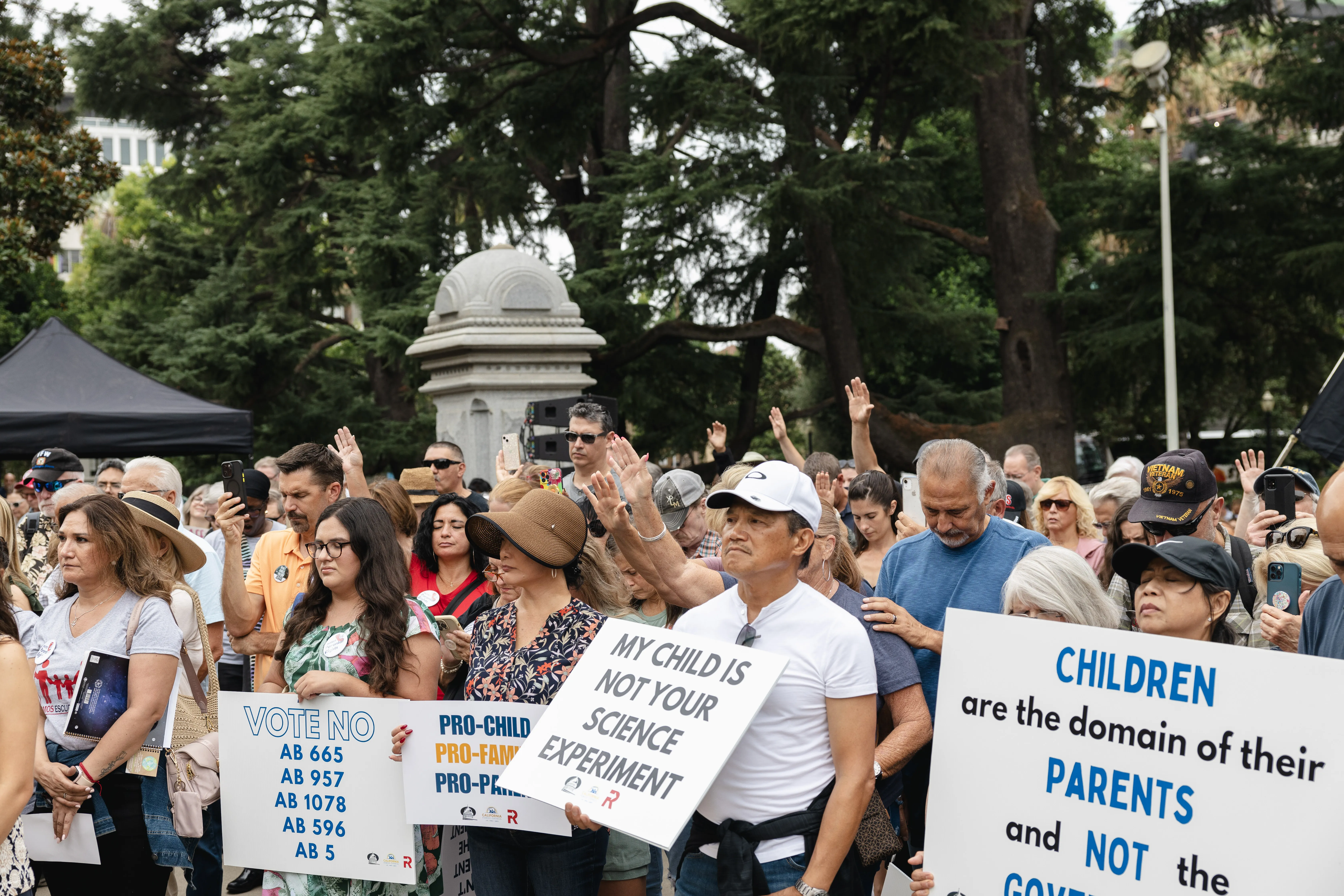 About 1,000 Californians rallied in front of the state capitol steps in Sacramento on Aug. 21, 2023, to protest a series of bills they say would take away their rights as parents. Credit: Snejanna Yalanji