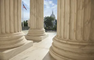 U.S. Capitol viewed through the columns of the U.S. Supreme Court in Washington, D.C. Shutterstock