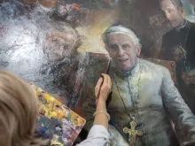Natalia Tsarkova works on a portrait of Pope Emeritus Benedict XVI in her studio in central Rome.
