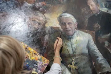 Natalia Tsarkova works on a portrait of Pope Emeritus Benedict XVI in her studio in central Rome
